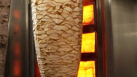 Rotating Shawarma Meat Cone on Vertical Rotisserie Grill Street Food Stock Footage 335119838