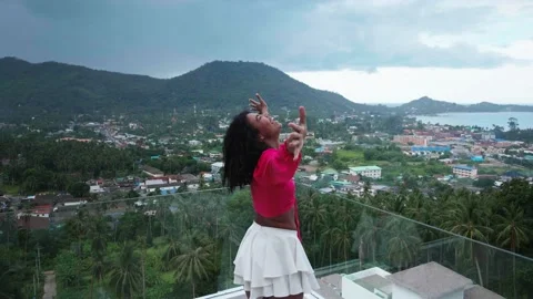 Rotating shot of an attractive multi-ethnic woman circling around herself Stock Footage 202876569