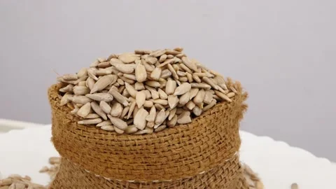Rotating shot of brown bag filled with sunflower seeds Stock-Footage 160885597