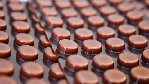 Rotating shot of brown colored packets on a white background Vídeo Stock 147699515