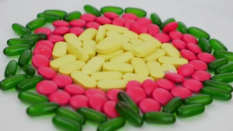 Rotating shot of colorful tablets placed over a white background Stock-Footage 147700348