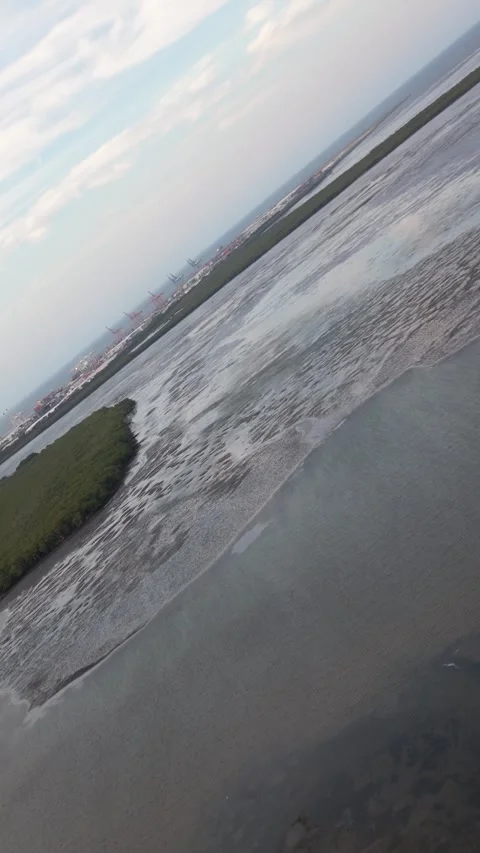 Rotating shot of Drone flying over a tidal flat ecosystem in Brisbane Australia Stock-Footage 330977664