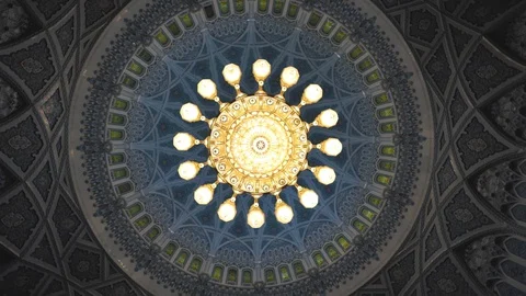 Rotating shot of a gigantic ceiling lighting with Arabic decoration Stock Footage 128104447
