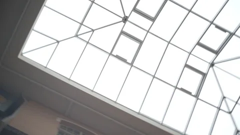 Rotating Shot of the Glass Ceiling in the Building / Mall/ Supermarket. 4K Stock Footage 129174165