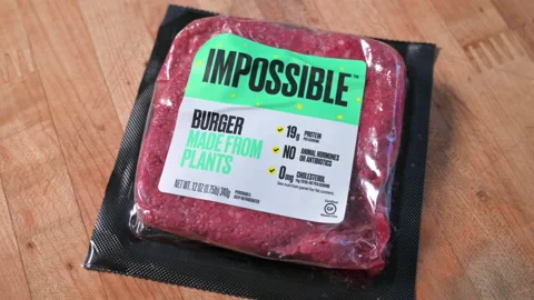 Rotating shot of Impossible Burger package of vegan meat Stock Footage 146034333
