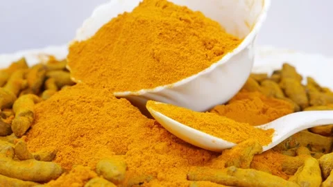 Rotating shot plastic bowl filled with turmeric powder Video stock 147696331