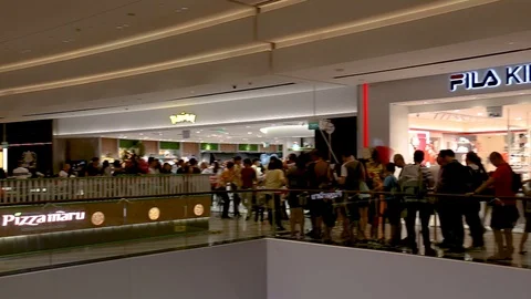 Rotating shot of queue for Pokemon centre inside of Jewel Changi Airport, Stock Footage 108268074