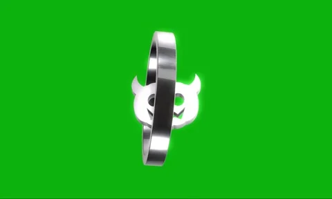 Rotating silver metal ring with spooky devil pumpkin icon isolated on green.. Stock Footage 346499533