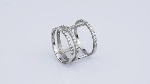 Rotating silver ring with reflection on white background. Video rotation 360 Stock Footage 291171409