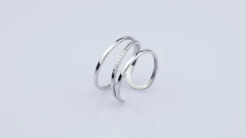 Rotating silver ring with reflection on white background. Video rotation 360. Stock Footage 291171410