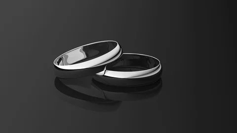 Rotating silver wedding rings as 3d rendering Stock Footage 111040459
