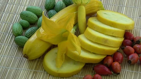 Rotating slice of zucchini, mouse melon and wild rose hips Stock Footage 82966183