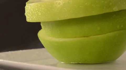 Rotating Sliced Green Apple - Crane Up Video stock 22024286