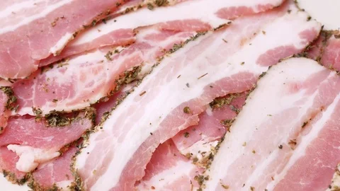 Rotating slices of bacon. Stock Footage 70877413