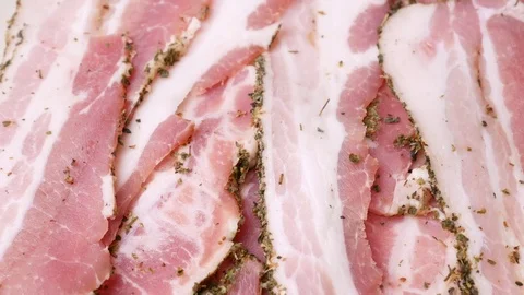 Rotating slices of bacon. Stock Footage 70877524