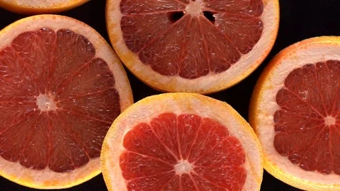 Rotating slices of grapefruit Stock Footage 70053855