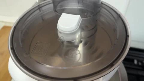 Rotating slicing disc blade inside food processor, vegetable cutting mechanism Stock Footage 337117800