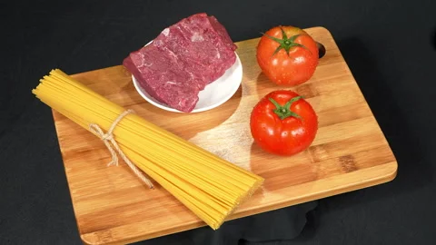 Rotating Spaghetti Bolognese Raw Ingredients Video stock 345600565