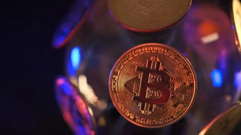 Rotating sphere with Bitcoin cryptocoins currency  with gold lights on black Stock Footage 269452131
