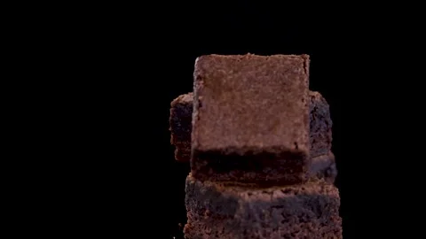 Rotating Stack of Chocolate Brownie Squares on Black Background Stock Footage 315028253