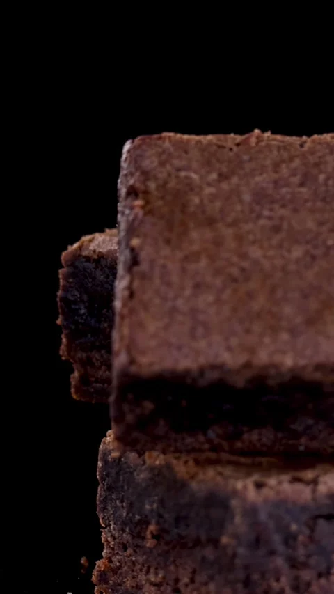 Rotating Stack of Chocolate Brownies on Black Background Stock Footage 315423389