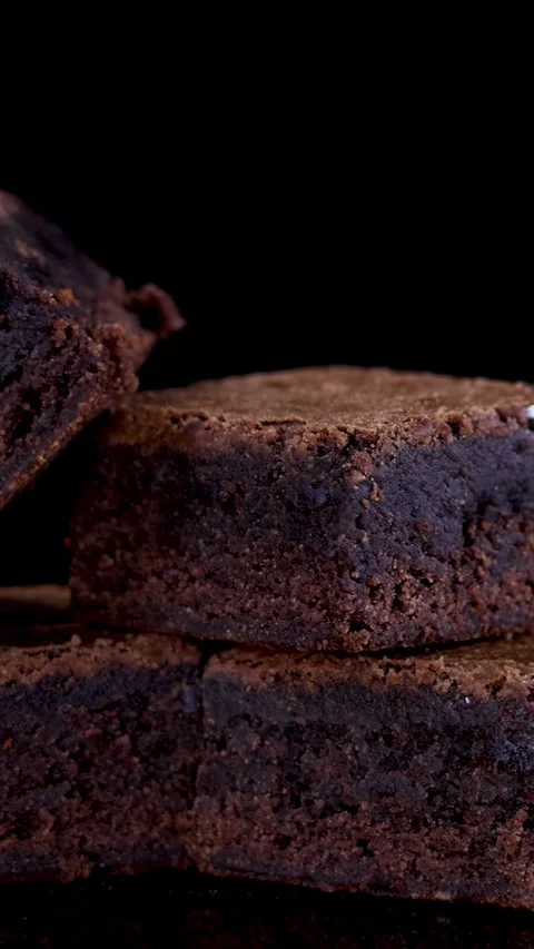 Rotating Stack of Chocolate Brownies on Black Background Stock Footage 315726466