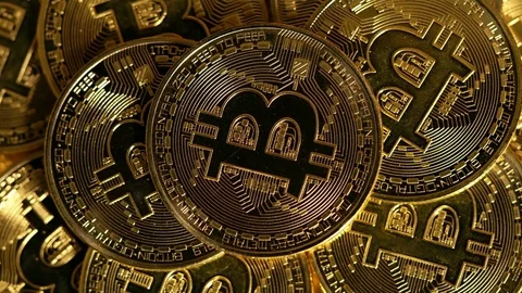 Rotating stack of gold bitcoins on turntable Stock Footage 74362035