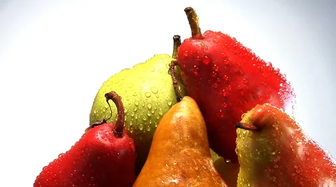 Rotating stack of organic red, yellow and green pears Stock Footage 46585381
