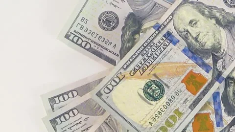 Rotating stack of US dollar banknotes viewed from the top, seamless spinning mot Stock Footage 272440804