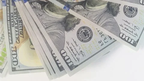 Rotating stack of US dollar banknotes viewed from the top, seamless spinning mot Stock Footage 272442306