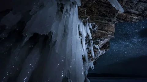 Rotating star sky at night. View through ice cave. Video stock 62232545