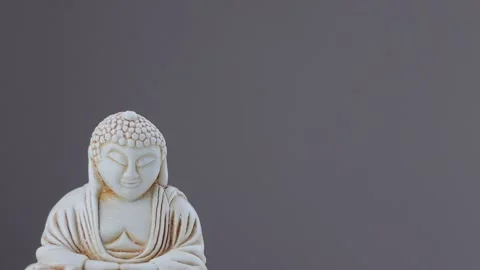 Rotating statue of meditating Buddha Stock Footage 219209930