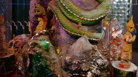 Rotating statuettes in the Buddhist temple Stock Footage 78885257