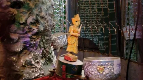 Rotating statuettes in the Buddhist temple Stock Footage 78885258