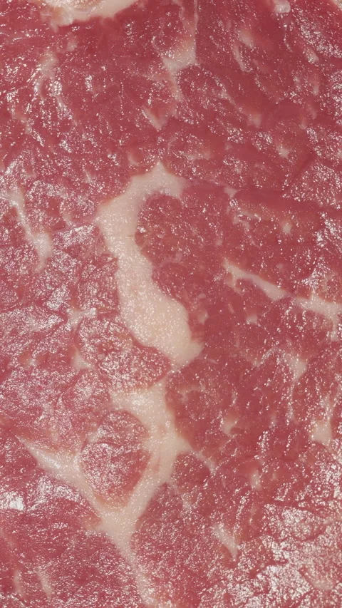 Rotating steak macro video. View from above Vertical video. Vídeos de archivo 241576722