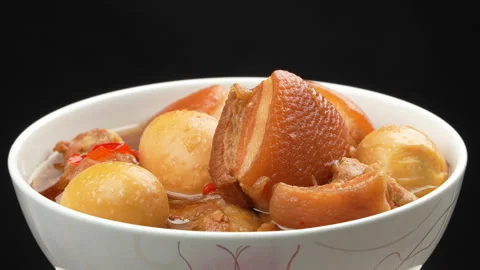 Rotating Steaming Vietnamese Braised Pork Eggs Black Background Vídeo Stock 329662443