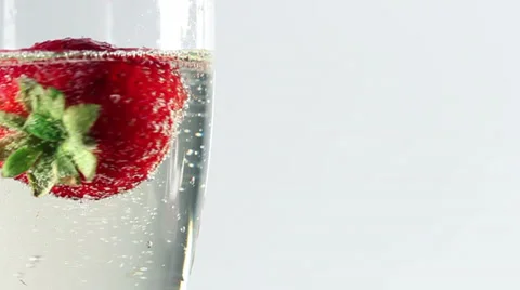 Rotating strawberry in champagne Stock Footage 37064926