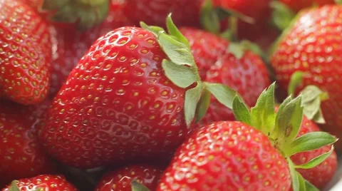 Rotating strawberry. Fresh, ripe, juicy, delicious strawberries.  Macro shot. Stock Footage
