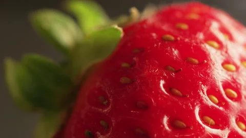 Rotating strawberry macro Stock Footage 132093954