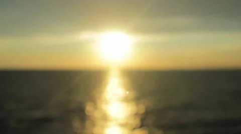 Rotating Sunrays from a Sunset over the Ocean Stock Footage 8578330