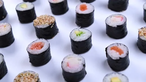 Rotating sushi maki rolls on white background Stock Footage 220337504