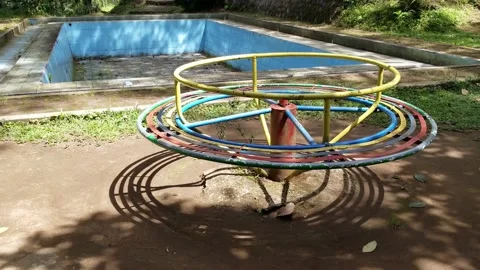 Rotating swing in the abandoned park Stock Footage 208857471