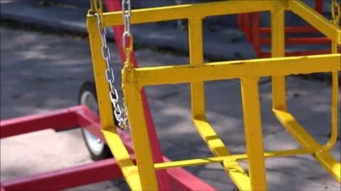 Rotating swing for children in the park Stock Footage 155592336