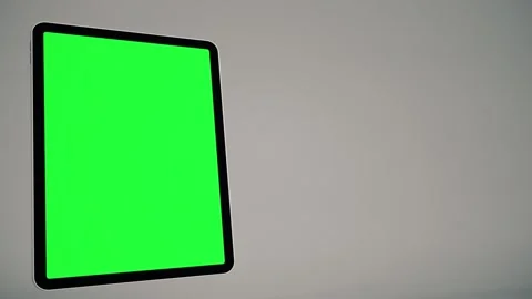 Rotating Tablet With Green Screen Flying In and Out Stock Footage 340293497