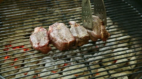 Rotating Tenderloins on the Grill Stock Footage 24412273