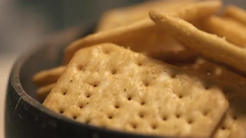 Rotating texture of Movin cracker with salt in a plate close-up, bokeh. Stock Footage 146279633