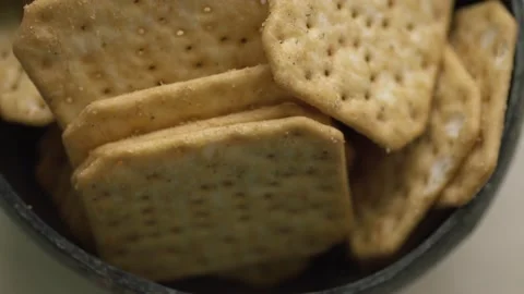 Rotating texture of Movin cracker with salt in a plate close-up, bokeh. Stock Footage 146279690