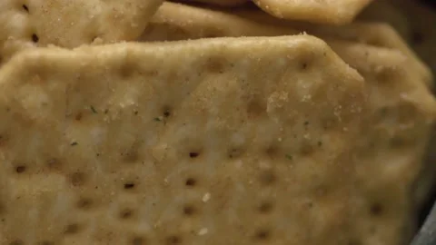 Rotating texture of Movin cracker with salt in a plate close-up, bokeh. Stock Footage 146279727