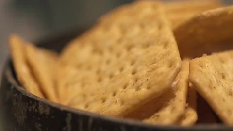 Rotating texture of Movin cracker with salt in a plate close-up. Stock Footage 146279778