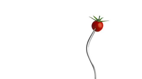 Rotating tomato on the fork Stock Footage 35571240